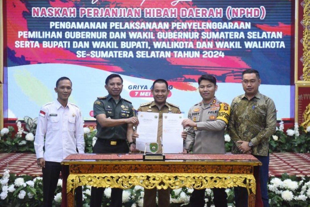 Pj Bupati Empat Lawang Hadiri Penandatanganan NPHD untuk Pengamanan Pemilukada 2024