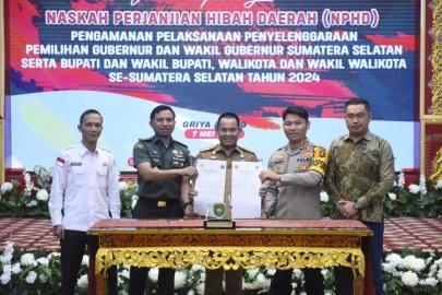 Pj Bupati Empat Lawang Hadiri Penandatanganan NPHD untuk Pengamanan Pemilukada 2024
